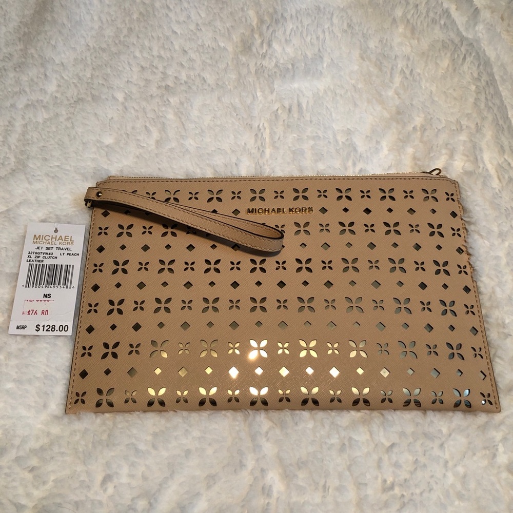 Michael Kors Jet Set XL Zip Peach Leather Clutch.